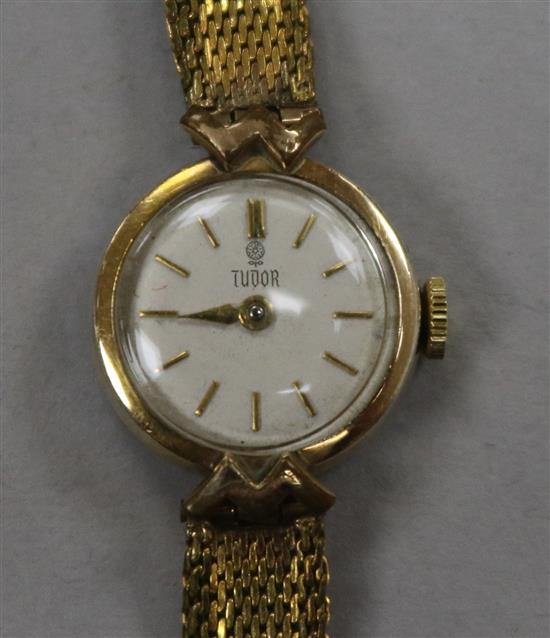 A ladys gold plated Tudor manual wind wrist watch.